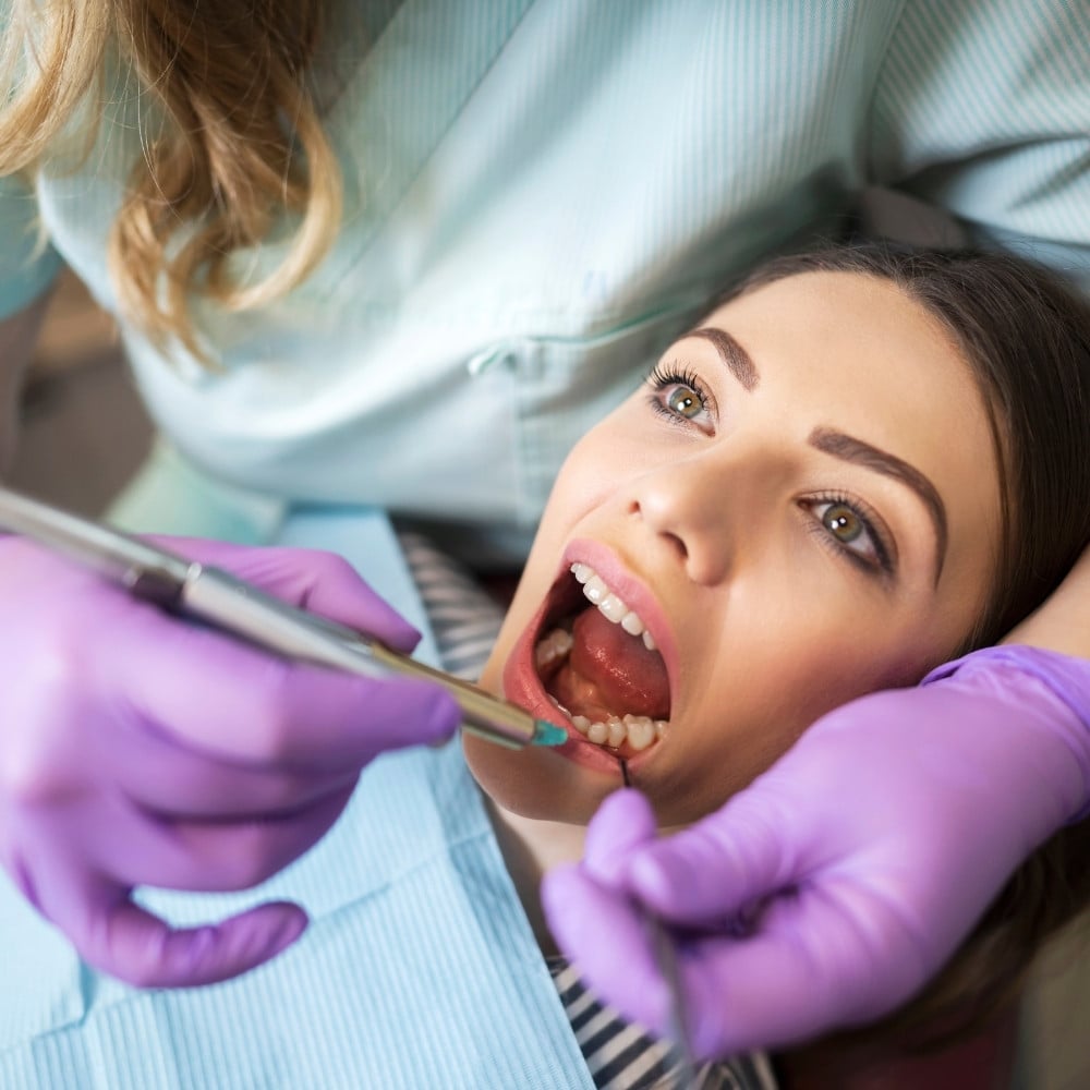 female patient getting dental cleaning at Everbright Smiles Scarborough, ON