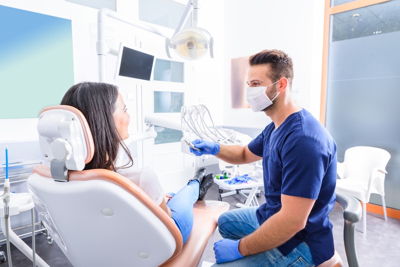Family Dental Checkup Consultation in Scarborough Clinic Dentist consulting with a patient during a routine dental checkup appointment in a Scarborough clinic